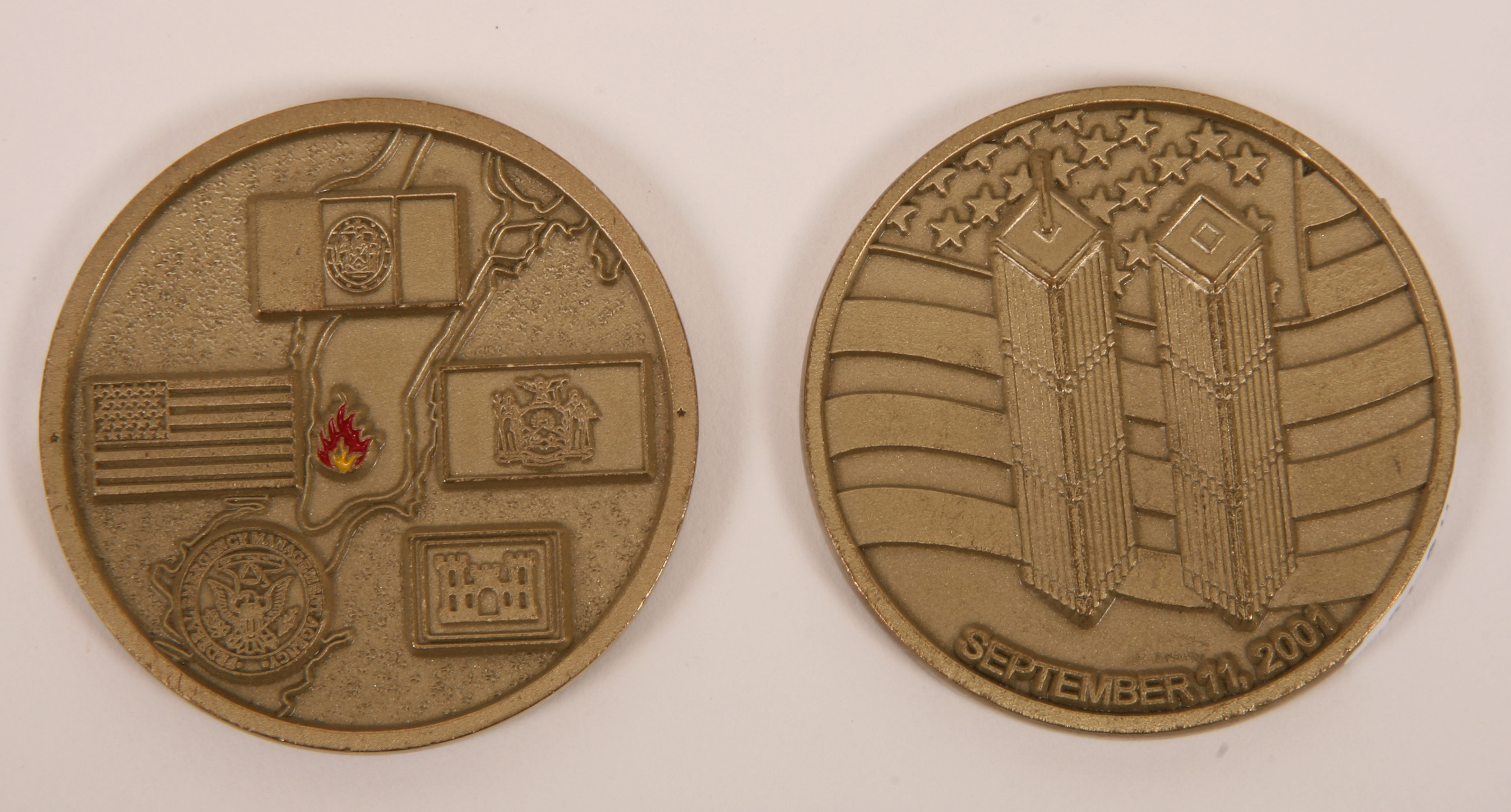 two sides of an embossed memorial coin